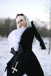 Rating: Safe Score: 0 Tags: 1girl bangs black_dress blurry blurry_background depth_of_field dress hairband long_sleeves looking_at_viewer outdoors solo standing suigintou User: admin