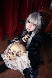 Rating: Safe Score: 0 Tags: 1girl dress gothic_lolita indoors lips lolita_fashion long_hair looking_at_viewer red_eyes silver_hair sitting solo suigintou User: admin