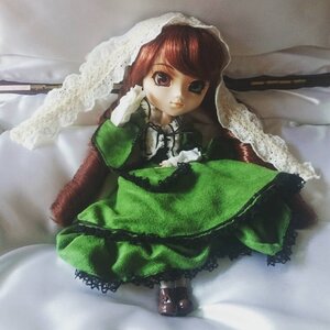 Rating: Safe Score: 0 Tags: 1girl bangs brown_hair doll dress frills green_dress long_hair long_sleeves looking_at_viewer sitting solo suiseiseki User: admin