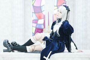 Rating: Safe Score: 0 Tags: 1girl black_legwear blurry blurry_background boots depth_of_field dress frills hairband long_hair long_sleeves ribbon sitting solo suigintou User: admin