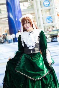 Rating: Safe Score: 0 Tags: 1girl 3d blurry blurry_background blurry_foreground brown_hair building depth_of_field dress green_dress long_sleeves looking_at_viewer outdoors photo photo_background skirt_hold solo suiseiseki User: admin