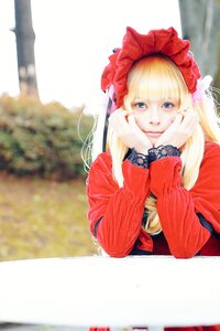 Rating: Safe Score: 0 Tags: 1girl bangs blonde_hair blue_eyes blurry blurry_background bonnet chin_rest closed_mouth depth_of_field flower head_rest long_hair long_sleeves looking_at_viewer photo red_dress shinku sitting smile solo User: admin