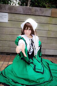 Rating: Safe Score: 0 Tags: 1girl brown_hair dress green_dress green_eyes long_sleeves looking_at_viewer outstretched_arm outstretched_hand sitting smile solo suiseiseki User: admin