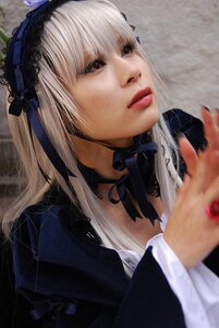 Rating: Safe Score: 0 Tags: 1girl black_ribbon blurry choker depth_of_field frills hairband lips long_hair realistic ribbon silver_hair solo suigintou User: admin