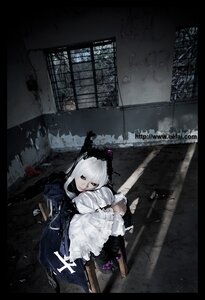 Rating: Safe Score: 0 Tags: 1girl dress frills indoors letterboxed sitting solo suigintou white_hair window User: admin