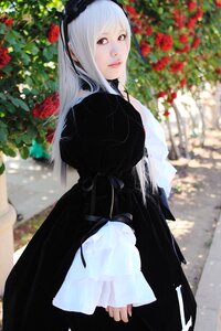 Rating: Safe Score: 0 Tags: 1girl bangs black_dress blurry blurry_background depth_of_field dress flower frills hairband lace lips long_hair long_sleeves looking_at_viewer outdoors red_eyes red_flower solo suigintou User: admin