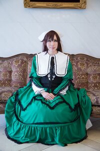 Rating: Safe Score: 0 Tags: 1girl blue_eyes brown_hair couch dress frills green_dress lips long_hair long_sleeves looking_at_viewer sitting solo suiseiseki User: admin