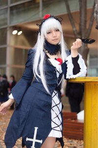 Rating: Safe Score: 0 Tags: 1girl blurry blurry_background depth_of_field dress feathers flower hairband long_hair long_sleeves looking_at_viewer skirt solo standing suigintou white_hair User: admin