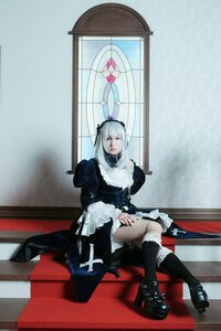 Rating: Safe Score: 0 Tags: 1girl black_footwear black_legwear boots dress frills high_heels long_hair long_sleeves sitting solo suigintou User: admin