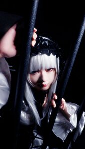 Rating: Safe Score: 0 Tags: 1girl bangs blurry closed_mouth depth_of_field dress frills lips long_hair looking_at_viewer red_eyes solo suigintou User: admin