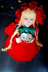 Rating: Safe Score: 0 Tags: 1girl auto_tagged bangs blonde_hair blue_eyes bonnet bow cup dress flower frills long_hair long_sleeves looking_at_viewer red_dress rose saucer shinku sitting solo teacup User: admin