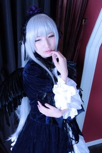 Rating: Safe Score: 0 Tags: 1girl bangs black_dress black_wings closed_eyes closed_mouth curtains dress feathers frills gothic_lolita hairband long_hair long_sleeves pale_skin silver_hair solo standing suigintou wings User: admin
