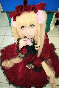 Rating: Safe Score: 0 Tags: 1girl blonde_hair blue_eyes blurry bow chain-link_fence depth_of_field dress fence flower hair_bow hair_ornament lips looking_at_viewer photo realistic red_dress shinku solo User: admin