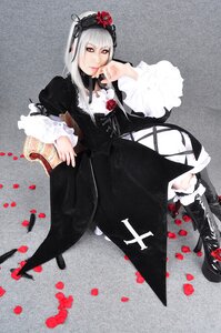 Rating: Safe Score: 0 Tags: 1girl black_dress boots dress flower frills gothic_lolita hairband lolita_fashion long_hair long_sleeves looking_at_viewer petals red_eyes rose silver_hair solo suigintou User: admin