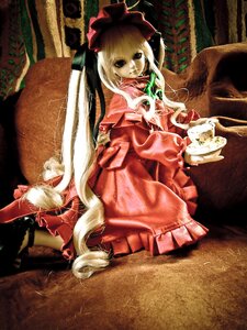 Rating: Safe Score: 0 Tags: 1girl blonde_hair bow doll dress frills hat long_hair looking_at_viewer red_dress shinku sitting solo User: admin