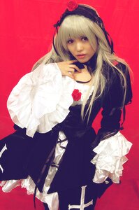 Rating: Safe Score: 0 Tags: 1girl bangs black_dress blonde_hair choker dress flower gothic_lolita lips lolita_fashion long_hair long_sleeves red_background red_flower red_rose rose simple_background sleeves_past_wrists solo suigintou User: admin