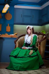 Rating: Safe Score: 0 Tags: 1girl apron blue_eyes brown_hair cup dress food green_dress long_hair painting_(object) sitting solo suiseiseki User: admin