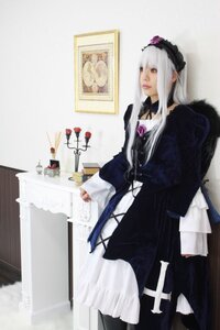 Rating: Safe Score: 0 Tags: 1girl blurry dress frills hairband long_hair long_sleeves photo red_eyes silver_hair solo standing suigintou User: admin