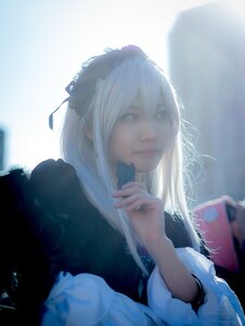 Rating: Safe Score: 0 Tags: 1girl blurry closed_mouth hair_ribbon holding holding_book lips long_hair long_sleeves phone ribbon solo suigintou upper_body white_hair User: admin