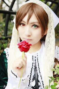 Rating: Safe Score: 0 Tags: 1girl blurry blurry_background brown_hair depth_of_field flower green_eyes heterochromia holding holding_flower lips looking_at_viewer red_eyes red_flower rose solo suiseiseki upper_body User: admin