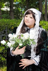 Rating: Safe Score: 0 Tags: 1girl black_dress bouquet brown_hair dress flower frills lace lips long_sleeves maid outdoors solo suiseiseki veil white_flower User: admin