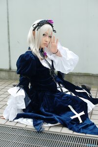 Rating: Safe Score: 0 Tags: 1girl black_dress dress frills gothic_lolita hairband lolita_fashion long_hair long_sleeves looking_at_viewer ribbon sitting solo suigintou User: admin