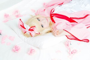 Rating: Safe Score: 0 Tags: 1girl blonde_hair blue_eyes blurry depth_of_field dress flower hinaichigo lips looking_at_viewer red_ribbon ribbon smile solo striped User: admin