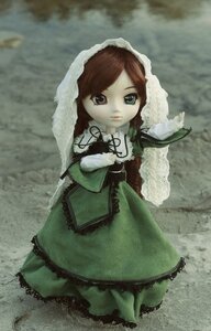 Rating: Safe Score: 0 Tags: 1girl brown_hair doll dress frills green_dress long_hair long_sleeves looking_at_viewer outdoors solo standing suiseiseki veil User: admin