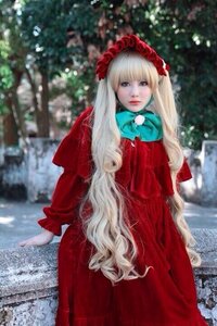 Rating: Safe Score: 0 Tags: 1girl bangs blonde_hair blurry blurry_background bonnet depth_of_field dress long_hair long_sleeves looking_at_viewer photo red_dress shinku solo standing very_long_hair User: admin