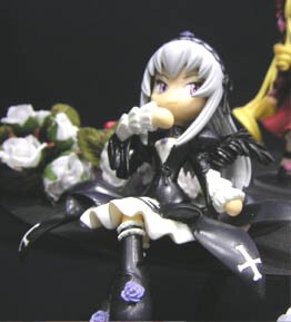 Rating: Safe Score: 0 Tags: 1girl armor doll holding long_hair purple_eyes solo suigintou white_hair User: admin