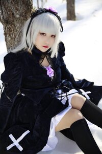 Rating: Safe Score: 0 Tags: 1girl black_legwear blurry blurry_background hairband jewelry lolita_fashion long_sleeves looking_at_viewer red_eyes sitting solo suigintou thighhighs User: admin