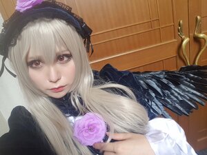 Rating: Safe Score: 0 Tags: 1girl closed_mouth flower hairband lips long_hair long_sleeves looking_at_viewer pink_rose red_eyes rose solo suigintou User: admin