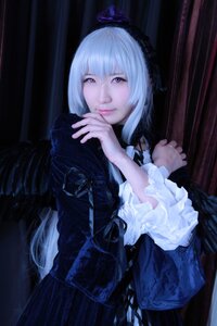 Rating: Safe Score: 0 Tags: 1girl bangs closed_mouth dress frills gothic_lolita indoors lips lolita_fashion long_sleeves looking_at_viewer own_hands_together realistic solo suigintou User: admin