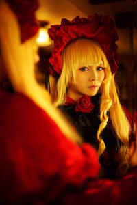 Rating: Safe Score: 0 Tags: 1girl bangs blonde_hair blue_eyes blurry bonnet depth_of_field dress flower lips long_hair looking_at_viewer realistic red_flower red_rose rose shinku solo User: admin