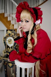 Rating: Safe Score: 0 Tags: 1girl bangs blonde_hair blue_eyes blurry blurry_background blurry_foreground bonnet bookshelf chin_rest closed_mouth depth_of_field dress indoors lace library lips lolita_fashion long_hair long_sleeves looking_at_viewer red_dress shinku sitting solo User: admin