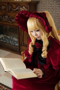 Rating: Safe Score: 0 Tags: 1girl blonde_hair blue_eyes blurry blurry_background bonnet book depth_of_field dress drill_hair flower indoors lips long_hair long_sleeves realistic red_dress rose shinku sitting solo User: admin