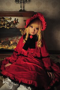 Rating: Safe Score: 0 Tags: 1girl bangs blonde_hair blue_eyes bonnet dress flower frills lips long_hair long_sleeves looking_at_viewer red_dress rose shinku sitting solo User: admin