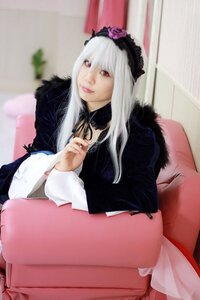 Rating: Safe Score: 0 Tags: 1girl blurry blurry_background closed_mouth depth_of_field flower frills fur_trim hairband lips lolita_fashion long_hair long_sleeves looking_at_viewer red_eyes sitting solo suigintou white_hair User: admin