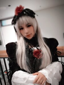 Rating: Safe Score: 0 Tags: 1girl bangs blurry blurry_background closed_mouth depth_of_field dress flower hair_ornament indoors lips long_hair long_sleeves looking_at_viewer photo red_flower red_rose rose solo suigintou table upper_body white_hair User: admin