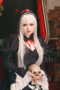 Rating: Safe Score: 0 Tags: 1girl black_dress blurry dress flower gothic_lolita hairband lips lolita_fashion long_hair long_sleeves looking_at_viewer red_eyes rose sitting solo suigintou User: admin