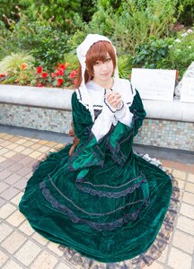 Rating: Safe Score: 0 Tags: 1girl brick_wall brown_hair bush chain-link_fence dress fence flower garden green_dress long_sleeves looking_at_viewer outdoors pavement sitting smile solo suiseiseki tile_floor tiles User: admin