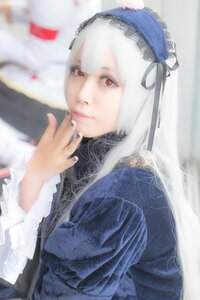 Rating: Safe Score: 0 Tags: 1girl bangs blurry blurry_background blurry_foreground closed_mouth depth_of_field frills hairband long_hair long_sleeves looking_at_viewer nail_polish red_eyes ribbon silver_hair solo suigintou upper_body User: admin