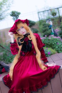 Rating: Safe Score: 0 Tags: 1girl blonde_hair blue_eyes blurry blurry_background bonnet depth_of_field dress flower frills lips long_hair looking_at_viewer outdoors photo red_dress rose shinku solo User: admin