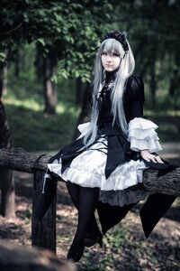 Rating: Safe Score: 0 Tags: 1girl black_footwear black_legwear blurry blurry_background closed_mouth depth_of_field dress frills gothic_lolita hairband lolita_fashion long_hair long_sleeves outdoors solo standing suigintou User: admin