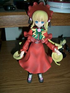 Rating: Safe Score: 0 Tags: 1girl blonde_hair blue_eyes bonnet bow bowtie capelet cup doll dress figure flower full_body green_bow long_hair long_sleeves looking_at_viewer photo red_capelet red_dress rose saucer shinku shoes solo standing teacup twintails User: admin