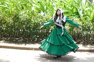 Rating: Safe Score: 0 Tags: 1girl brown_hair dress green_dress long_hair long_sleeves outdoors outstretched_arms solo standing suiseiseki sunlight User: admin
