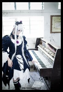 Rating: Safe Score: 0 Tags: 1girl auto_tagged blonde_hair boots dress flower frills hair_ornament instrument letterboxed long_hair pillarboxed sheet_music solo suigintou User: admin