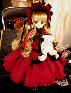 Rating: Safe Score: 0 Tags: 1girl blonde_hair blue_eyes bonnet bow curtains doll dress expressionless long_hair long_sleeves looking_at_viewer red_dress shinku sitting solo twintails very_long_hair User: admin