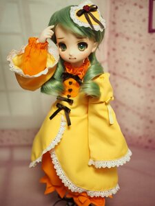 Rating: Safe Score: 0 Tags: 1girl doll dress frills green_eyes green_hair hat kanaria long_sleeves orange_dress pantyhose solo wide_sleeves yellow_dress User: admin