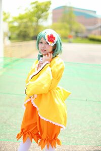 Rating: Safe Score: 0 Tags: 1girl blurry blurry_background day depth_of_field flower green_hair hair_flower hair_ornament kanaria long_sleeves looking_at_viewer outdoors short_hair solo standing yellow_dress User: admin
